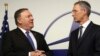 U.S. Secretary of State Mike Pompeo, left, speaks with NATO Secretary General Jens Stoltenberg prior to a meeting at NATO heaquarters in Brussels, Dec. 4, 2018.