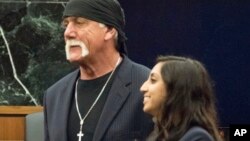 FILE - Former professional wrestler Hulk Hogan, left, stands with attorney Seema Ghatnekar, in a courtroom in St. Petersburg, Fla., March 18, 2016. A jury awarded Hogan $115 million in an invasion of privacy case against Gawker Media.