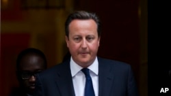 FILE - Britain's Prime Minister David Cameron leaves 10 Downing Street in London.