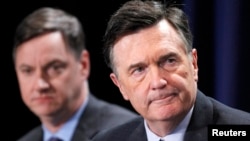 FILE - Dennis Lockhart, President, Federal Reserve Bank of Atlanta, and Charles Evans (L), President and CEO, Federal Reserve Bank of Chicago, take part in a panel discussion in Beverly Hills, California, May 1, 2012.