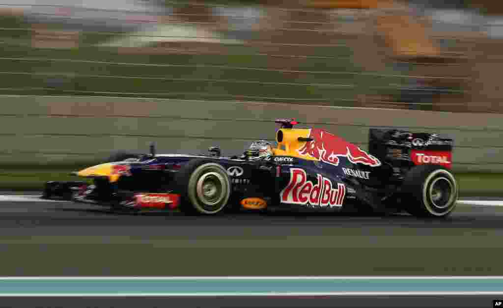 Red Bull driver Sebastian Vettel of Germany steers his car during the second free practice at the Yas Marina racetrack, in Abu Dhabi, United Arab Emirates, Friday, Nov. 2