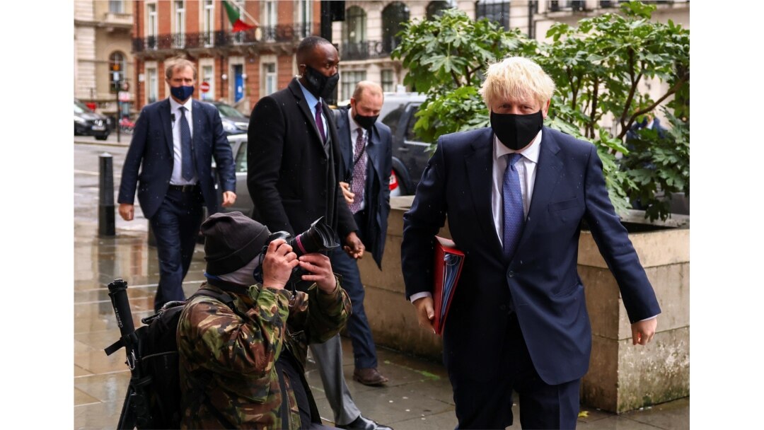 British Prime Minister Boris Johnson is seen outside the BBC headquarters, as the spread of the coronavirus disease (COVID-19) continues, in London, October 4, 2020.