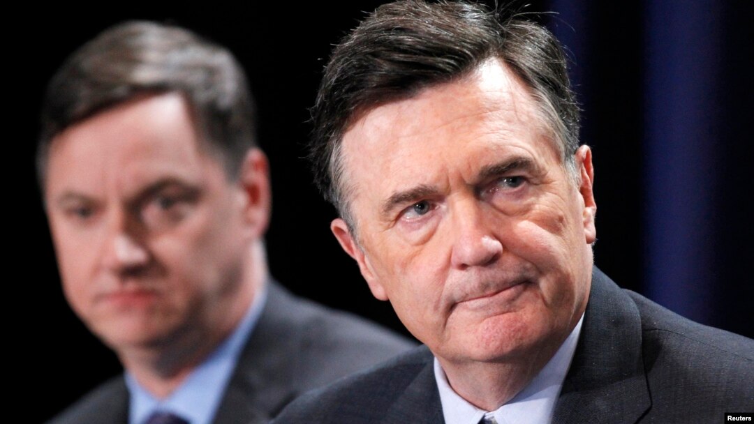 FILE - Dennis Lockhart, President, Federal Reserve Bank of Atlanta, and Charles Evans (L), President and CEO, Federal Reserve Bank of Chicago, take part in a panel discussion in Beverly Hills, California, May 1, 2012.