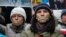 Pro-European integration supporters with taped mouths attend a rally against newly approved anti-protest laws in Kyiv, Jan. 17, 2014.