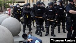 Martin Gugino lays on the ground after he was shoved by two Buffalo, New York, police officers during a protest against the death in Minneapolis police custody of George Floyd in Buffalo, New York