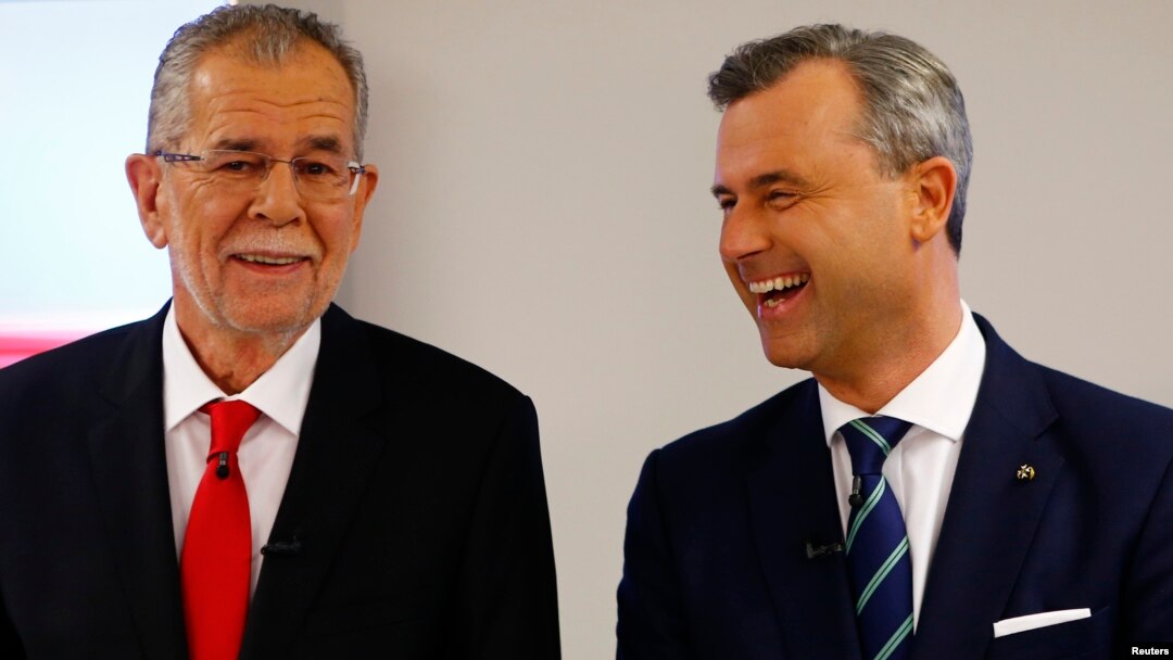 Austrian presidential candidates Alexander Van der Bellen, left, who is running as an independent, and Norbert Hofer, who represents the far-right, pose for photographers before a TV debate in Vienna, Austria, Dec. 1, 2016. 