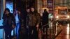 Young people leave the scene of an attack in Istanbul, early Jan. 1, 2017. Turkey's state-run news agency said an armed assailant has opened fire at a nightclub in Istanbul's Ortakoy district.