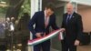 Hungarian State Secretary for Economic Strategy László György, left, cuts a ribbon as Ambassador László Szabó looks on at the opening ceremony of a business promotion center in Washington in May 2019.