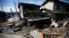 Submerged and destroyed houses are seen in a flooded area in Mabi town in Kurashiki, Okayama Prefecture, Japan, July 9, 2018.