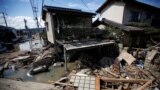 Submerged and destroyed houses are seen in a flooded area in Mabi town in Kurashiki, Okayama Prefecture, Japan, July 9, 2018.