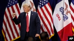 President Donald Trump acknowledges supporters after speaking at the Republican Party of Iowa's America First Dinner, June 11, 2019, in West Des Moines. 