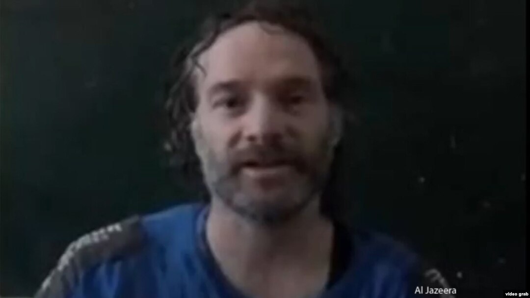 Journalist Peter Theo Curtis is shown in this image from a video obtained by Al Jazeera.