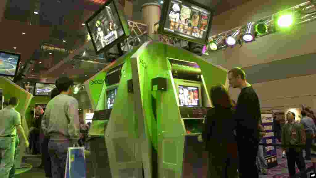 Attendees of the Comdex computer show try out the new Microsoft XBox game, Nov. 13, 2001, at the Las Vegas Convention center. 