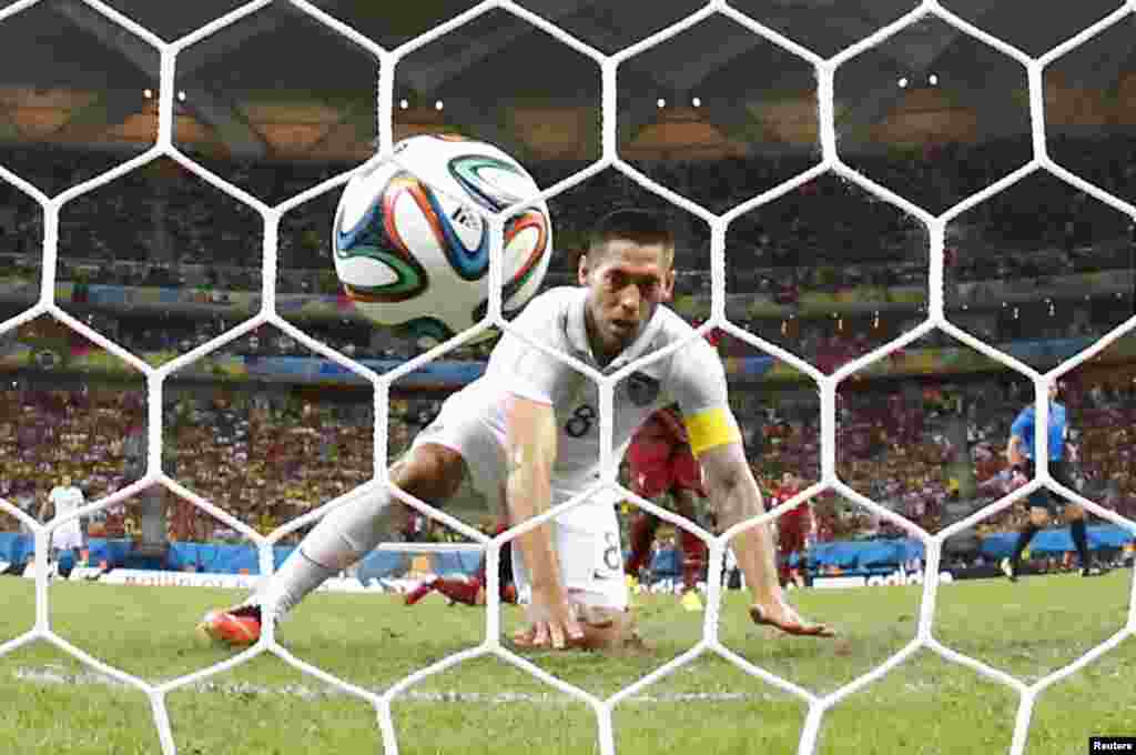 Clint Dempsey of the U.S. watches after knocking the ball into the net against Portugal at the Amazonia arena in Manaus, June 22, 2014.&nbsp;