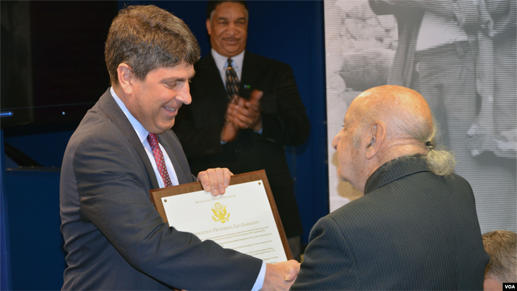 BBG Chairman Jeffrey Shell presents Leo Sarkisian with a Resolution the Board passed in 2012 when Sarkisian retired.