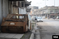 On streets of Iraqi-controlled eastern Mosul, evidence of the war is omnipresent, like this armored car bomb on Feb. 12, 2017. (H.Murdock/VOA)