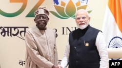 Le président nigérian Bola Ahmed Tinubu et le Premier ministre indien Narendra Modi.