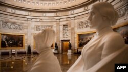 FILE - An empty rotunda is seen in the U.S. Capitol, in Washington, March 24, 2020.