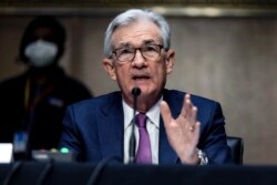 U.S. Federal Reserve Board Chairman Jerome Powell testifies during his re-nomination hearing before a Senate Committee, on Capitol Hill in Washington, Jan. 11, 2022.