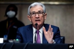 U.S. Federal Reserve Board Chairman Jerome Powell testifies during his re-nomination hearing before a Senate Committee, on Capitol Hill in Washington, Jan. 11, 2022.