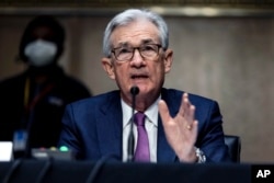 FILE - U.S. Federal Reserve Board Chairman Jerome Powell speaks on Capitol Hill in Washington, Jan. 11, 2022.