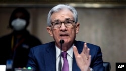 U.S. Federal Reserve Board Chairman Jerome Powell testifies during his re-nomination hearing before a Senate Committee, on Capitol Hill in Washington, Jan. 11, 2022. 