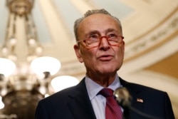 FILE - In this Oct. 22, 2019, photo, Senate Minority Leader Sen. Chuck Schumer of N.Y., speaks to members of the media following a Senate policy luncheon on Capitol Hill in Washington.