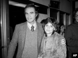 FILE - Burt Reynolds and Sally Field attend the off-Broadway play "Buried Child" in New York, Dec. 23, 1978.