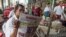 A Myanmar man reads a newspaper reporting on US President-elect Donald Trump's win in the US presidential election in Yangon on November 10, 2016. - Trump's extraordinary US election victory sent shockwaves across the world, as opponents braced for a "dan