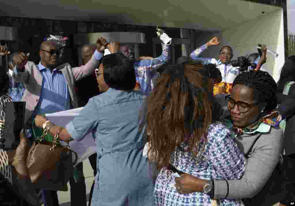 Supporters of former Ivory Coast President Laurent Gbagbo and former youth minister Charles Ble Goude, celebrate their acquittal outside the International Criminal Court in The Hague, Netherlands.