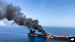 An oil tanker is on fire in the sea of Oman, June 13, 2019. Two oil tankers near the Strait of Hormuz were reportedly attacked Thursday, an assault that left one ablaze and adrift as sailors were evacuated from both vessels.