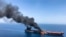 An oil tanker is on fire in the sea of Oman, June 13, 2019. Two oil tankers near the Strait of Hormuz were reportedly attacked Thursday, an assault that left one ablaze and adrift as sailors were evacuated from both vessels.