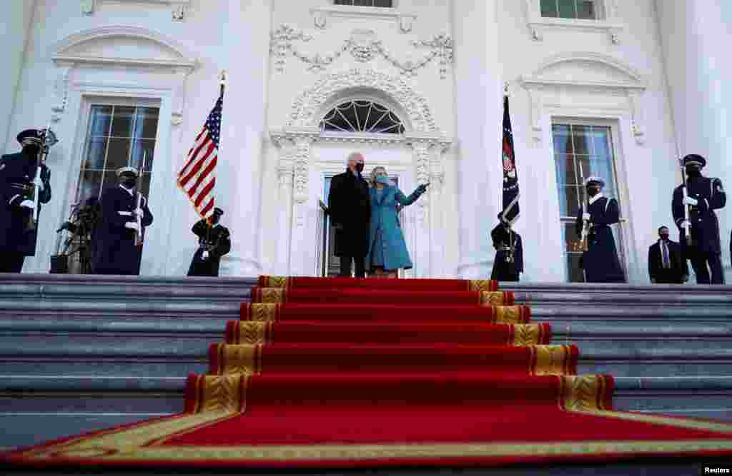 U.S. President Joe Biden and first lady Jill Biden stand at the North Portico of the White House, in Washington, Jan. 20, 2021. 