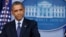 U.S. President Barack Obama pauses while speaking about the continuing government shutdown from the White House Briefing Room in Washington, Oct. 8, 2013. 