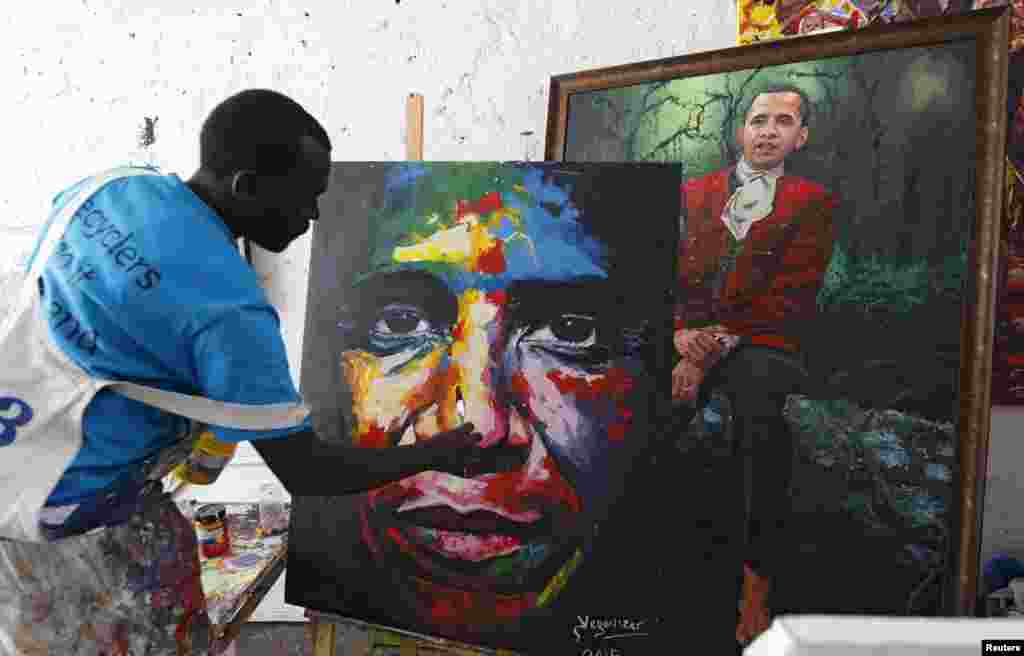 Kenyan artist Evans Yegon alias &quot;Yegonizer&quot; works on a portrait of U.S. President Barack Obama at a studio inside the Go-Down Art Center in Nairobi. Kenya is preparing for a visit by Obama in the coming week.