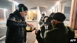 Bulgarians celebrate at a checkpoint at the Giurgiu-Ruse border point between Romania and Bulgaria on Jan. 1, 2025, as their country became full members of the Schengen free movement area.