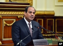 FILE - In this photo provided by Egypt's state news agency MENA, Egyptian President Abdel-Fattah el-Sissi, addresses parliament in Cairo, Feb. 13, 2016.