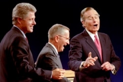Independent Ross Perot (C) seen here with Democratic Presidential nominee Governor Bill Clinton (L) and President George Bush at the 1992 presidential debate in Michigan, went on to win 19% of the popular vote in the November 1992 election.