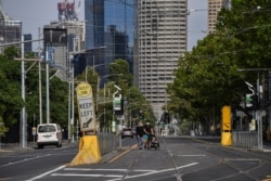 Jalanan di Melbolihat lengang, 13 Februari 2021, setelah pihak berwenang memberlakukan lockdown selama lima hari di seluruh negara bagian tersebut di tengah pandemi COVID-19. (Foto: Saeed KHAN / AFP)