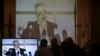 Hamas leaders and supporters listen to Khaled Mashaal, the outgoing Hamas leader in exile, during his news conference in Doha, Qatar, while displayed on a screen at Commodore hotel in Gaza City, Monday, May 1, 2017. 