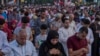 A Muslim woman lines up with Muslim men during Eid prayers in Giza, Egypt, June 15, 2018.