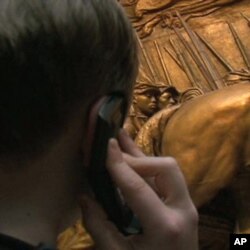 Digital technology gives National Gallery of Art visitor Max Gordy, 11, more options as he listens to an audio tour.