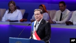Panama's new President Laurentino Cortizo wears the presidential sash as he speaks during his inauguration ceremony in Panama City, July 1, 2019. 