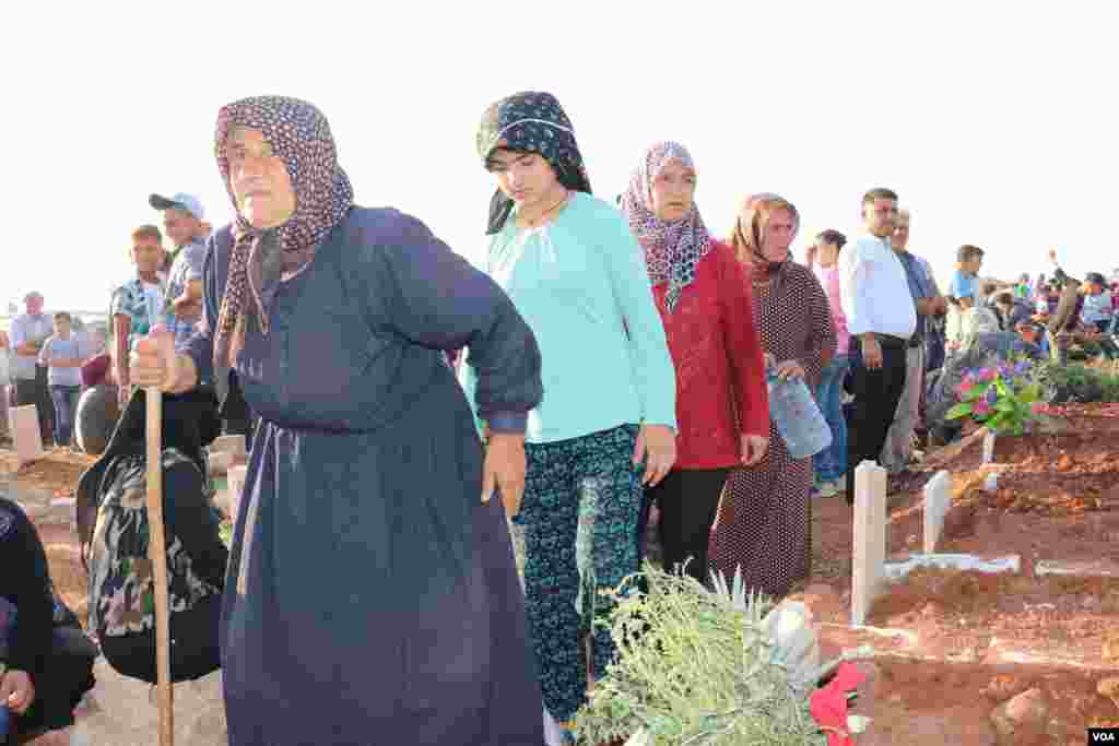 Displaced Afrin people visit the graves of their beloved ones in the eid