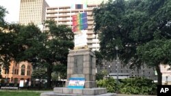 FILE - Only the pedestal is left after protesters removed a bust of John McDonogh, in Duncan Plaza in New Orleans, Louisiana, June 13, 2020. 