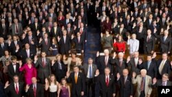 Members of the 113th U.S. Congress, many accompanied by family members, take the oath of office in the House of Representatives chamber on Capitol Hill in Washington, Thursday, Jan. 3, 2013.