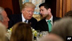 President Donald Trump talks with House Speaker Paul Ryan of Wisconsin at the Capitol on Thursday. (AP Photo/Evan Vucci)