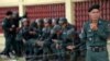 FILE - Cambodian police officers are posted outside a building in Phnom Penh, Aug. 22, 2018.