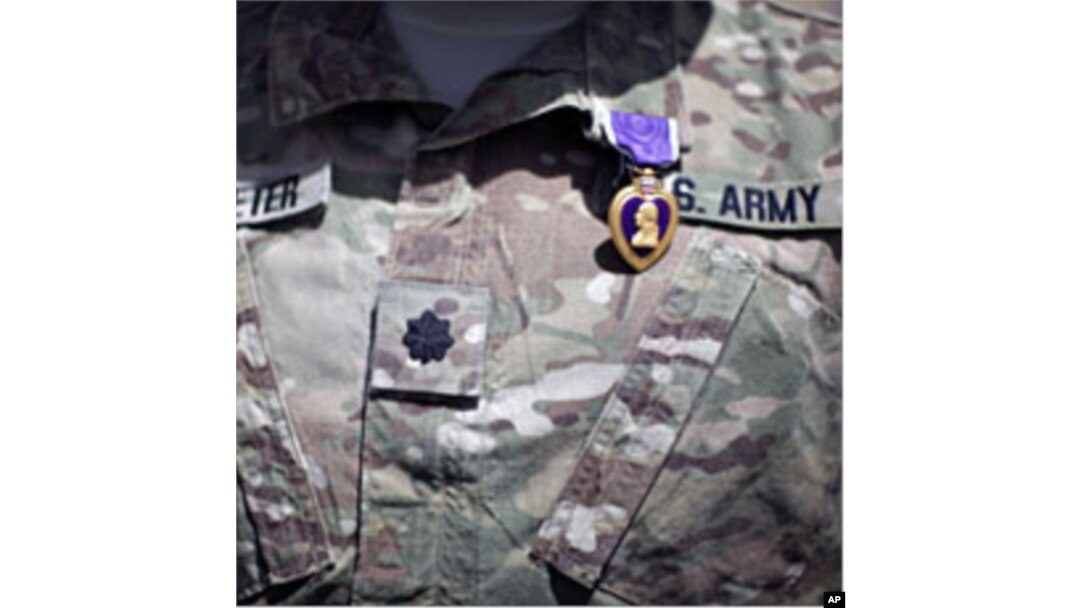 A Purple Heart medal is seen on the uniform of U.S Army Lt Colonel Alan Streeter after U.S. Secretary of Defense Robert Gates presented the award for wounds he received in combat, during a ceremony at Combat Outpost Andar in Ghazni Province, Afghanistan,