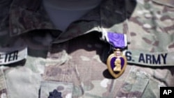 A Purple Heart medal is seen on the uniform of U.S Army Lt Colonel Alan Streeter.